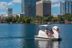 Couple enjoying a swan boat ride at Lake Eola Park
