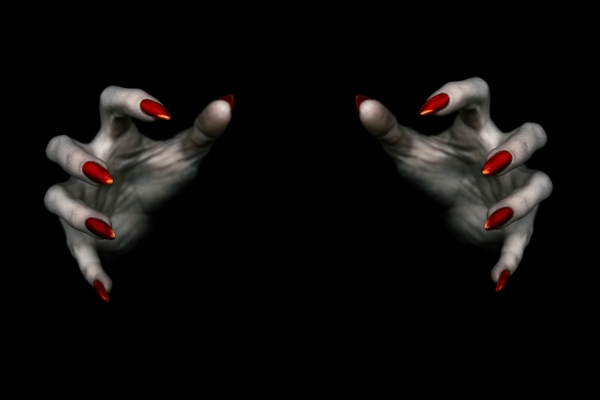 Gray hands with blood red long nails reach out from the darkness. 