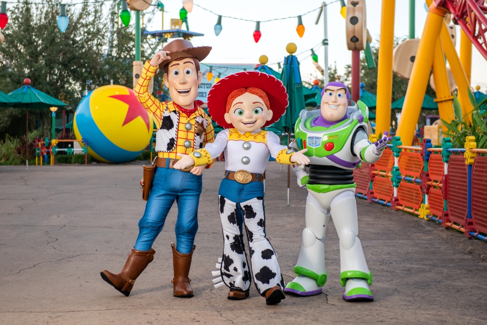 Woody, Jessie, and Buzz LIghtyear standing at Hollywood Studios. 