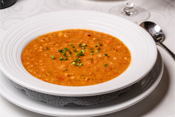 A bowl of red Alligator Bay Chowder soup on the menu at Everglades in Rosen Centre.