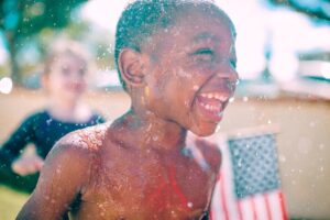 Two children play on the 4th of July, a day full of fireworks and fun, especially when spent at Universal Orlando 