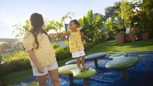 Mother's Day Ideas in Orlando - a mom and young daughter play at the EPCOT International Flower & Garden Festival