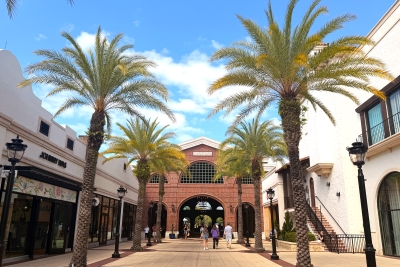 Palm trees swaying alongside the streets of Disney Springs near Rosen Centre in Orlando, an Orlando entertainment and shopping complex part of our family-friendly Orlando guide for beginners.