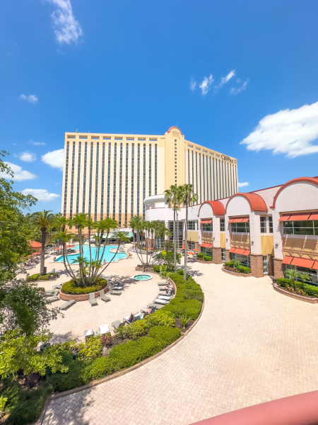 A view overlooking the sparkling swimming pool and spacious outdoor patio area at Rosen Centre hotel on International Drive in Orlando.