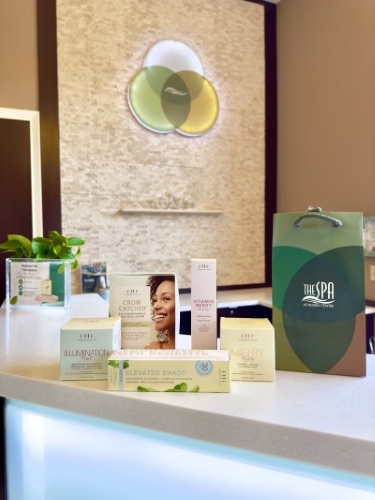 A serene counter with several products placed and a bag that says "The Spa at Rosen Centre." 