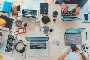 A photo of a networking group sharing creative ideas over coffee. 