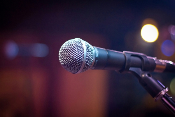 A close-up of a microphone on a stand. 
